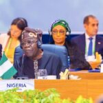 Tinubu at a conference